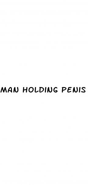 man holding penis